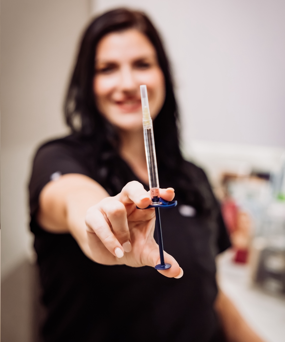 Dana preparing injectables in the treatment room
